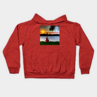 A Red Guitar Sitting On A Lake At Sunset Kids Hoodie